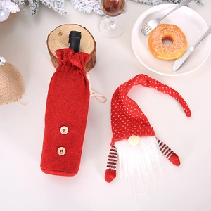 Festive red gnome wine bottle cover set with beard and buttons for Christmas table decor