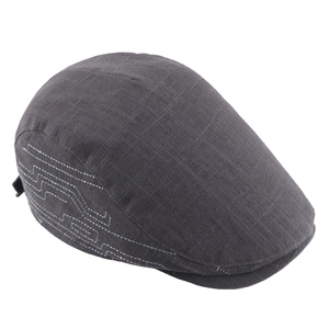 Classic dark grey linen newsboy cap with white geometric embroidery on white background