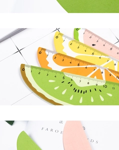 Detail of colorful wooden fruit rulers with precise scales for student stationery