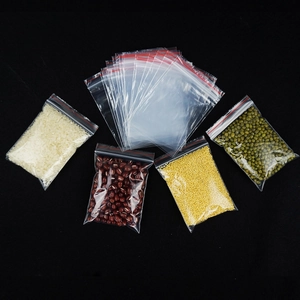 Detailed view of thick PE transparent resealable bags with red seal for grain storage