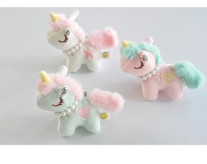 Detail of plush unicorn keychains with pearl necklaces and colorful embroidery