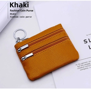 Close-up of khaki genuine leather coin purse with triple zipper and silver keychain
