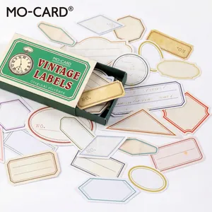 Lot de stickers d'étiquettes vintage pour scrapbooking dans une boîte verte