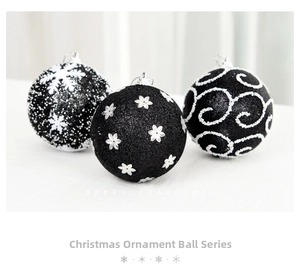 Macro detail of black Christmas balls with sparkling glitter snowflakes and swirls