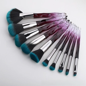 Macro detail of 10pcs makeup brush set with gradient crystal handles and dual-tone bristles