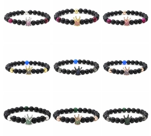 Macro display of crown beaded bracelets with matte black stones and colorful zircons