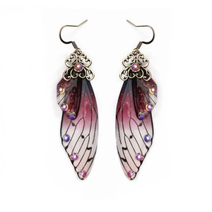 Detail of gradient purple butterfly wing earrings with sparkling rhinestones and bronze hooks