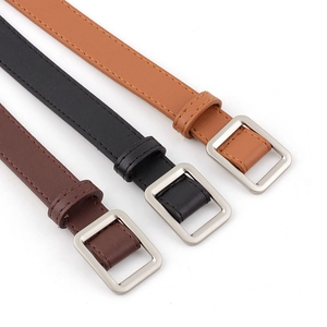 Three minimalist slim leather belts for women in khaki, black, and brown with silver buckles