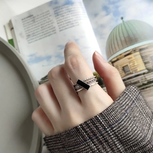 Macro shot of 925 sterling silver layered rings with black enamel rectangle detail