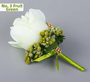 Detail of white rose boutonniere with fruit green berries and sparkling rhinestones