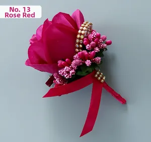 Detail of No.13 rose red fabric rose boutonniere with gold rhinestones and ribbons