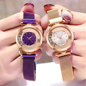 Detailed shot of purple and rose gold quartz watches with diamond-set mesh bands