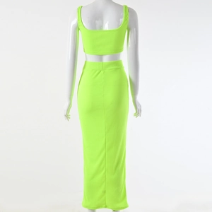 Rear view of neon green rib-knit two-piece set featuring a crop top and midi skirt
