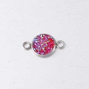 Macro detail of 10mm stainless steel drusy connector with red iridescent glitter stones