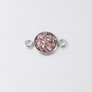 Macro view of a 10mm rose gold round drusy connector with double loops for jewelry making