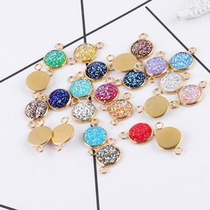 Close-up of 10mm gold vacuum plated stainless steel star charms in various colors