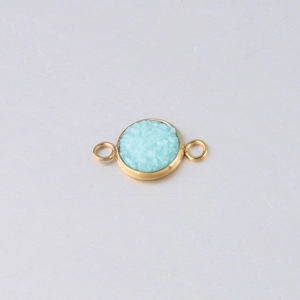 Detail of 10mm gold vacuum plated stainless steel star pendant with turquoise stone inlay