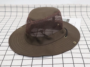 Detail of dark brown outdoor sun hat featuring breathable mesh fabric and a wide brim design