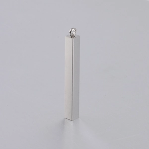 Close-up of a mirror-polished stainless steel rectangular bar pendant with a top bail
