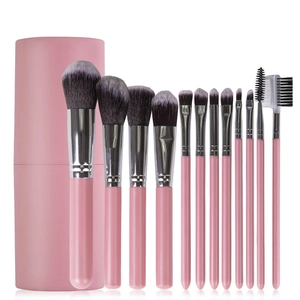 Professional 12pcs pink makeup brush set with cylindrical storage case on white background