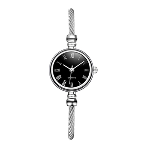 Detailed macro view of silver cable strap watch with black Roman numeral dial and quartz movement