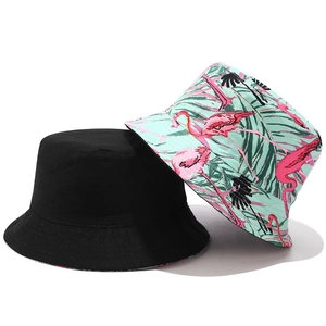 Dual-style reversible sun hat featuring solid black and tropical flamingo print designs