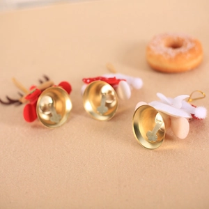 Three Christmas bell ornaments with golden finish and plaid reindeer antler plush decor