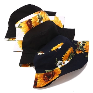 Various 3D sunflower print reversible bucket hats for women in black, white, and navy blue