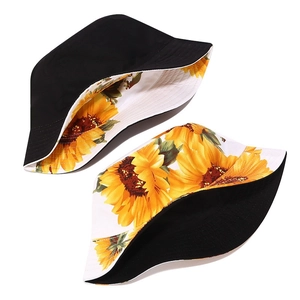 Reversible bucket hat with 3D sunflower print and plain black side for summer sun protection