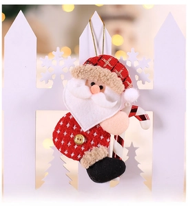 Detail of plush Santa Claus ornament with red knit texture and gold hanging cord