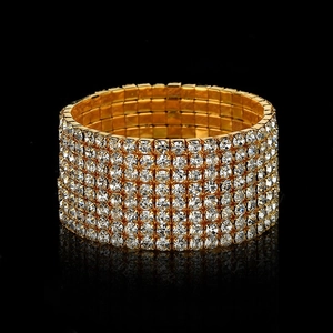 Macro shot of 7-row sparkling crystal pavé setting on a gold stainless steel wide band