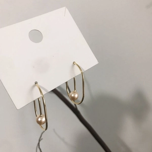 Minimalist gold-plated irregular curve drop earrings with elegant champagne pearls