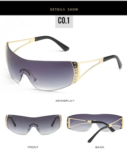 Detail view of Y2K rimless shield sunglasses with rhinestone star on gold metal frame
