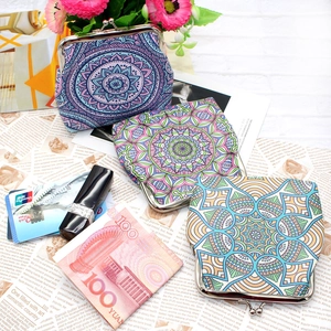 Detailed view of bohemian mandala canvas coin purses with metal clasps and cards