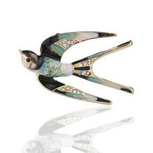 Detailed macro shot of a crystal-inlaid swallow brooch with colorful enamel finish