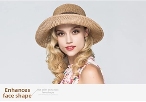 Close-up of woven straw sun hat brim with decorative brown band for face shaping