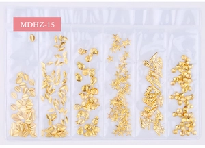 Detail view of 6-grid set with golden leaf, starfish, and seashell metal nail art charms