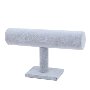 Gray velvet T-bar jewelry display stand for organizing bracelets and watches on white background