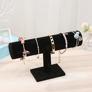 Detail of black velvet T-bar jewelry display stand for bracelets and watches
