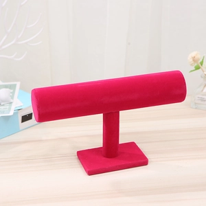 Detailed view of single tier T-bar jewelry display stand in rose red velvet finish