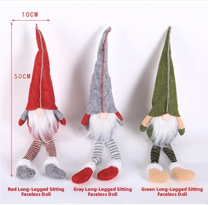 Detail of red grey and green Christmas gnomes with striped long legs and 50cm height