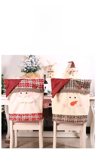 Detail of Santa and Snowman chair covers featuring red and brown plaid plush fabric