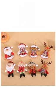 Flat lay of 8 Christmas plush ornaments including Santa, snowman, bear, and reindeer