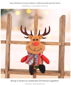Close-up of reindeer plush ornament with red nose and scarf hanging on a wooden ladder