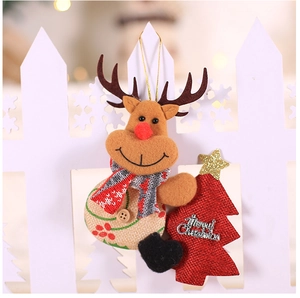 Detail of fabric reindeer ornament with Merry Christmas tree and knitted scarf