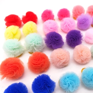 Colorful mesh net ball pet hair ties accessories arranged in multiple vibrant colors
