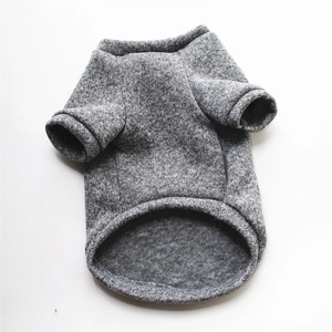 Close-up of thick fleece lining and heather gray knit texture on warm dog sweater