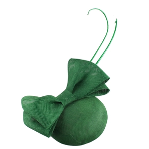 Detailed view of handmade green mesh pillbox hat with elegant bow and curved trim