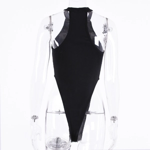 Detail view of the black ribbed knit texture and backless high-cut bodysuit design