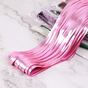 Close-up of pink matte metallic foil fringe curtain for party wall decoration